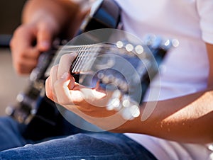 Guitar in the hands of the man