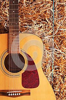 Guitar on a hay stack