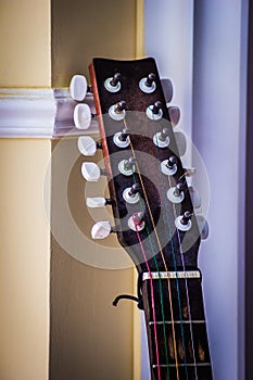 Guitar headstock on wall background