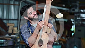 Guitar luthier measures spruce wood board with thickness gauge