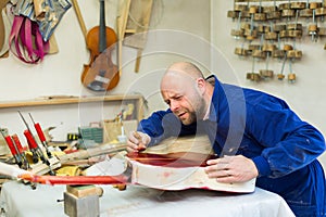 Guitar-maker at workshop