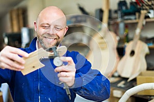 Guitar-maker at workshop