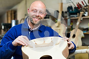 Guitar-maker at workshop