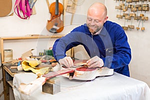 Guitar-maker at workshop