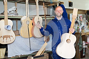 Guitar-maker at workshop