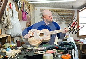 Guitar-maker at workshop