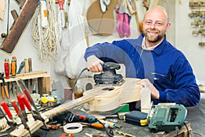 Guitar-maker at workshop