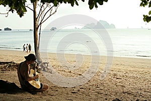 guitar man krabi beach thailand photo