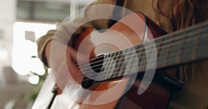 Guitar, music and hands with a woman playing a song inside as a musician, artist or performer closeup. Guitarist, live