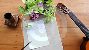 Guitar Music notes on table.