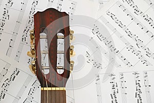 Guitar with music score background