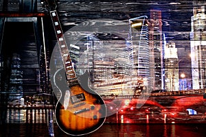 Guitar on night city background