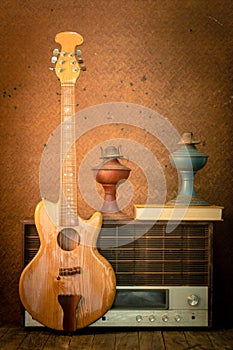 Guitar and old radio in vintage style