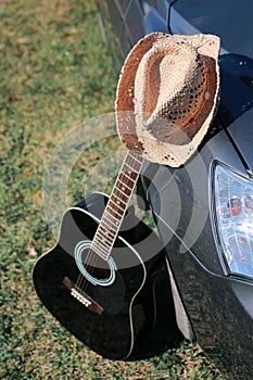 Guitar outdoor near car