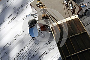 Guitar over song book photo