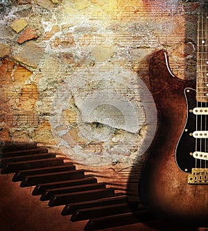 Guitar and piano on brick wall