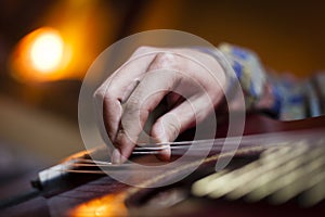 Guitar played by guitarist hand photo