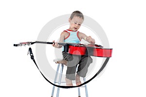 Guitar player 4 year old on a white background