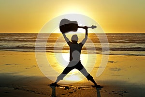 Guitar player on the beach