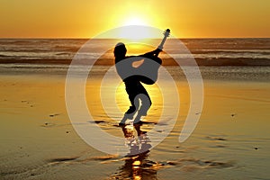 Guitar player on the beach