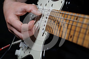 Guitar player on black background