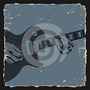 Guitar player on grunge background