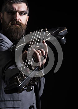 Guitar player hold electric instrument. Bearded man play guitar chord. Musician with guitar. My guitar gently weeps