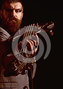 Guitar player hold electric instrument. Bearded man play guitar chord. Musician with guitar. My guitar gently weeps