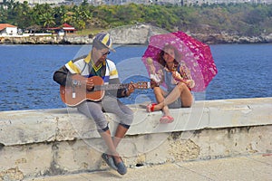 Guitar player in Malecon promenade in Havana, Cuba