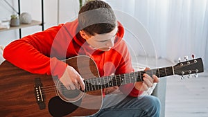 Guitar player music education man practicing home
