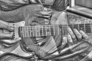 Guitar player tonemapped in black and white photo