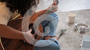 Guitar playing acoustic music home leisure woman