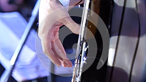 Guitar playing. Guitarist. Man hand and six-string electrical guitar. Close-up of guitarist with guitar