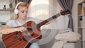 guitar playing professional woman home lesson