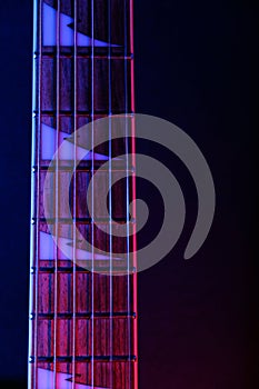 Guitar Strings, close up. Electric guitar.  With colorful blue and purple  illumination