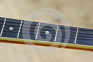 Guitar strings and fret board