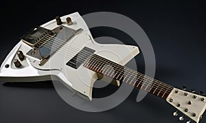 The guitar is white with black neck and white body