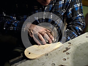 Guitars Luthiers sets up a stand under the arm. photo