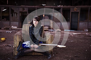 Guitarist on abandoned building