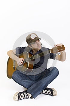 Guitarist with calibrating acoustic guitar