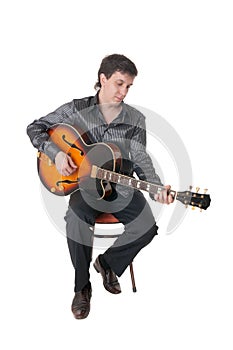 Guitarist on a chair