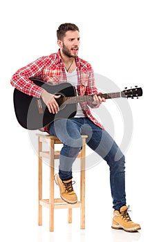 The guitarist on a chair