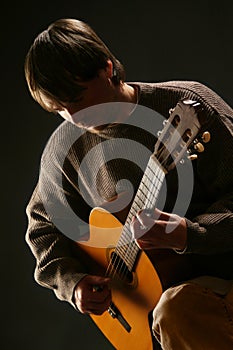 Guitarist classical acoustic guitar playing