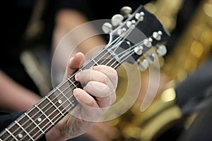 Guitarist Fingers the Frets photo