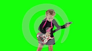 Guitarist girl playing rock music with toy guitar. Artist child performing live