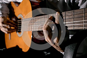 Guitarist hands and guitar close up. Playing classic guitar. Play the guitar