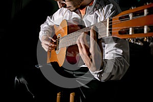 Guitarist hands and guitar close up. Playing classic guitar. Play the guitar