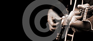 Guitarist hands and guitar close up. playing electric guitar black and white. copy space