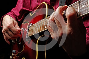 Guitarist hands and guitar close up. playing electric guitar. play the guitar.