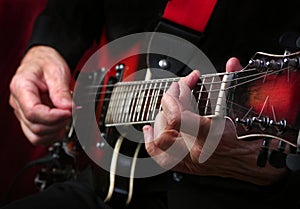 Guitarist hands and guitar. playing electric guitar.